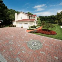 EP Henry Driveway in Old Towne Cobble™, Autumn Blend with Pewter Blend Splash and Soldier Course Border and Paver Art (Compass Rose)