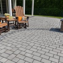 EP Henry ECO Cobble 6” x 6” and 6” x 9” Pewter Blend 16, Random Installation; Forma Charcoal Double Border pavers